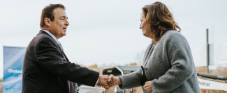 Secretary Tanner shaking hands with Speaker Shekarchi