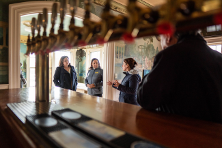 Secretary Tanner visiting a distillery 